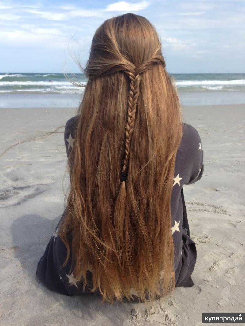 Девушка с длинными русыми волосами